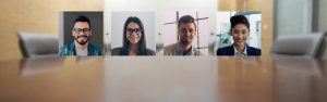 Conference calling with four business people. Unified business communications.